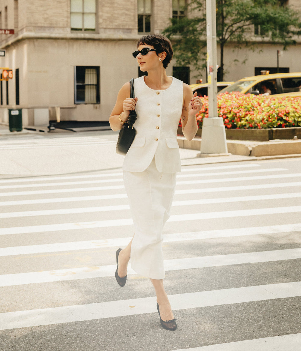 Influencer walking on 5th Avenue wearing Petite Studio's Business Casual collection